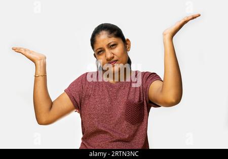 A close-up of a woman's face, making a frustrated expression with her eyebrows furrowed Stock Photo