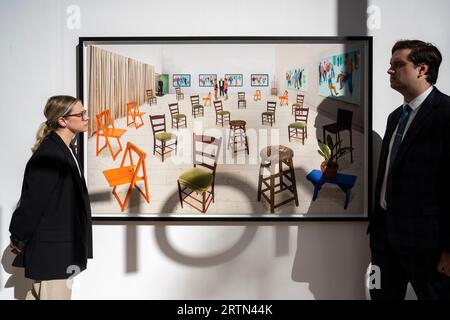 London, UK.  14 September 2023. Staff members view 'Sparer Chairs', 2014 (Est. £30,000 - 50,000) at a preview of an exhibition of works by British artist David Hockney ahead of their auction on 21 September at Phillips Berkeley Square.  Credit: Stephen Chung / Alamy Live News Stock Photo