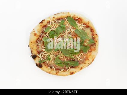 Margarita pizza with mozzarella cheese, dried basil, arugula isolated on white background. Pizza top view. Stock Photo