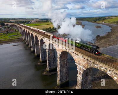 Berwick upon Tweed, England, UK. 14th September 2023. The Flying Scotsman steam train crosses the Royal Border Bridge across the River Tweed at Berwick Upon Tweed today on its way to Edinburgh. The special steam excursion marks the 100th anniversary of the most famous steam locomotive of all time.  Iain Masterton/Alamy Live News Stock Photo