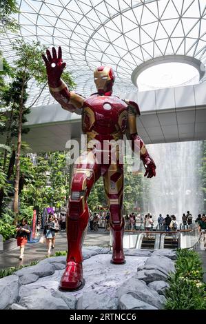 31.07.2023, Singapore, Republic of Singapore, Asia - Visitors in the garden of Shiseido Forest Valley with indoor waterfall at Jewel Changi Airport. Stock Photo