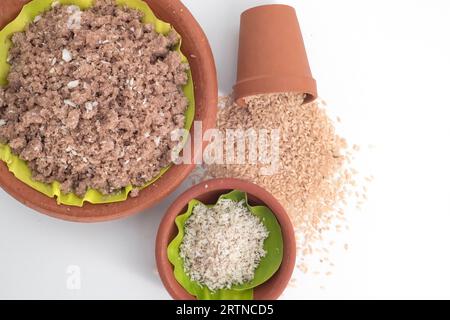 Selective Focused, Red chamba Puttu with coconut. Puttu is a South Indian and Sri Lankan breakfast dish which is steamed cylinders of ground rice Stock Photo