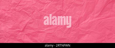 Texture of crumpled pink wrapping paper, closeup. Red old background Stock Photo