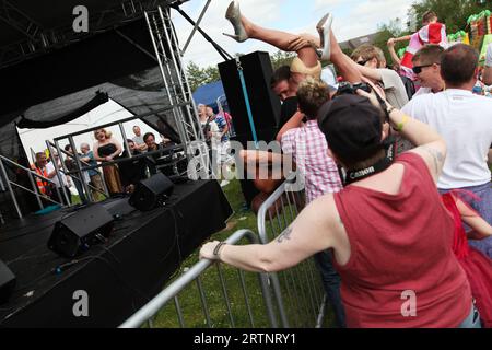 Oxford Pride protest event June 2013 - performer is tipped over gates Stock Photo