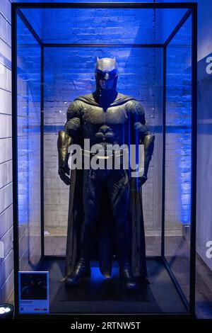 A costume worn in the movie The Batman at the DC Comics and Warner Bros ...