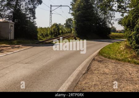 Road and railway splitting at the end of Duha (Rainbow) bridge with combined traffic in Bechyne town, Czech Republic Stock Photo