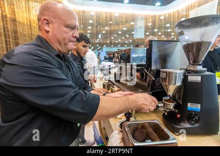 Detroit, Michigan, USA. 13th Sep, 2023. Baristas make coffee at the Lincoln exhibit during the North American International Auto Show. Credit: Jim West/Alamy Live News Stock Photo