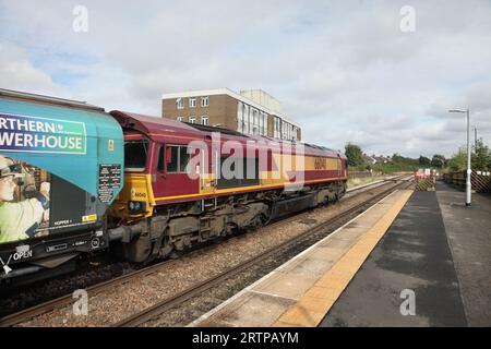 DBS Class 66 loco 66040 hauls the 4R51 1250 Drax Power Station to Immingham biomass service through Scunthorpe on 14/9/23. Stock Photo