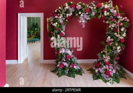 Royal Botanic Gardens, Edinburgh, Scotland, UK, 14 September 2023, Fleurs de Ville 'Voyage': a floral display created by talented local florists. Pictured: a heart shaped floral arrangements in Inverleith House. Credit: Sally Anderson/Alamy Live News Stock Photo