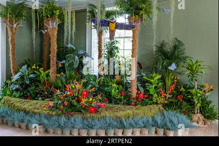 Royal Botanic Gardens, Edinburgh, Scotland, UK, 14 September 2023, Fleurs de Ville 'Voyage': a floral display created by talented local florists. Pictured: floral arrangements in Inverleith House depicting a jungle. Credit: Sally Anderson/Alamy Live News Stock Photo