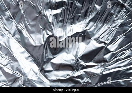Shiny silver foil close-up. Abstract background, glossy surface Stock Photo  - Alamy