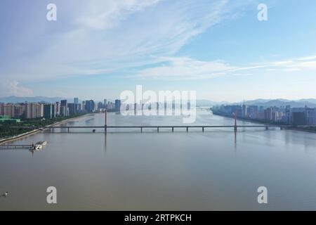 Hangzhou. 28th June, 2023. This aerial photo taken on June 28, 2023 shows the Qiantang River in Hangzhou, east China's Zhejiang Province. The 19th Asian Games will take place in Hangzhou between September 23 and October 8, featuring a total of 40 sports. It will be the third Asian Games to be hosted in China, after Beijing 1990 and Guangzhou 2010. The highly anticipated Asian Games can help boost the popularity of Hangzhou where history and modernity co-exist and further promote its culture. Credit: Huang Zongzhi/Xinhua/Alamy Live News Stock Photo