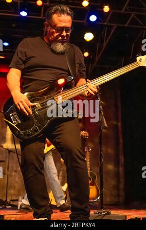 Bass guitarist Miguel DeJesus of Smalltown Poets in a live performance for Eddie Owen Presents at the Red Clay Music Foundry in Duluth, Georgia. (USA) Stock Photo