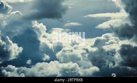 Dark storm clouds with breaking sunlight Stock Photo