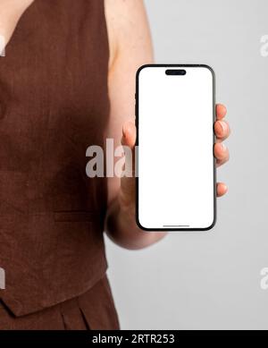 Hand holding mobile phone screen mockup, iphone 14 pro, business app advertising Stock Photo