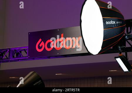 Signage for Godox photographic studio lighting equipment at a trade show exhibition. Stock Photo