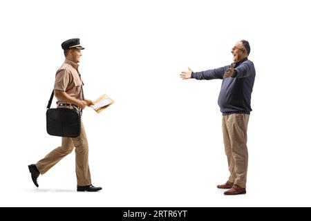 Mailman delivering a letter to a happy mature man isolated on white background Stock Photo