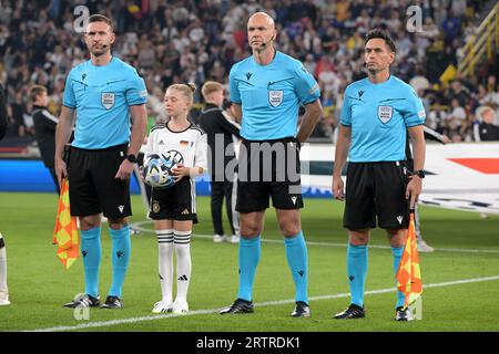 DORTMUND - Referee Anthony Taylor with his assistants Daniel Cook and Gary Beswick during the friendly Interland match between Germany and France at the Signal Iduna Park on September 12, 2023 in Dortmund, Germany. ANP | Hollandse Hoogte | GERRIT VAN COLOGNE Stock Photo