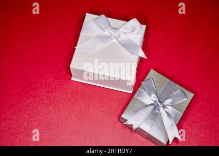 Various Gift Boxes with Ribbon and Bows isolated on Red Stock Photo