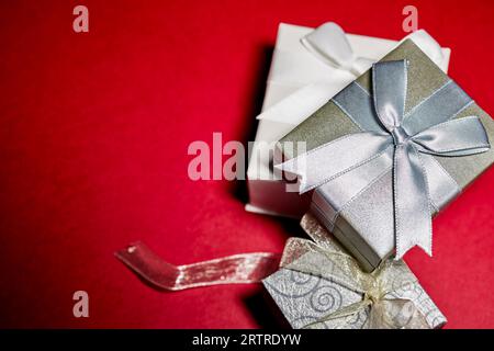 Various Gift Boxes with Ribbon and Bows isolated on Red Stock Photo