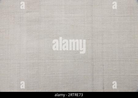 Natural Light Linen Texture. Detailed Closeup vintage old textured fabric burlap, rustic background in tan beige, brown, grey. Canvas Macro Pattern. Stock Photo