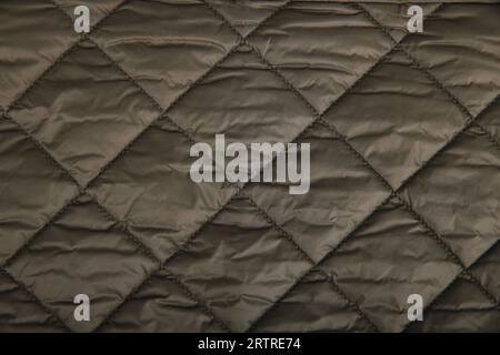textile background. Quilted fabric background. texture blanket or puffer jacket Stock Photo