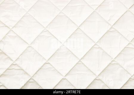 textile background. Quilted fabric background. texture blanket or puffer jacket Stock Photo