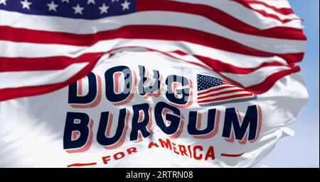 Arthut, US, June 2023: Flags of Doug Burgum election campaign and the national flag of the United States waving. 2024 US presidential elections. Illus Stock Photo