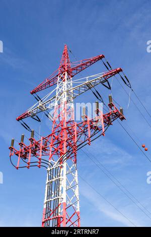 High-voltage pylon, red and white, power lines, overhead lines, Baden-Wuerttemberg, Germany Stock Photo