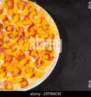 Delicious Hawaiian pizza with pineapple, ham and mozzarella Stock Photo