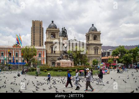 La Paz, Bolivia, October 24, 2015: People on Plaza Murillo with the cathedral in the background Stock Photo