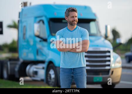 Men driver near lorry truck. Man owner truck . Serious middle aged man trucker trucking owner. Transportation industry vehicles. Handsome man driver Stock Photo