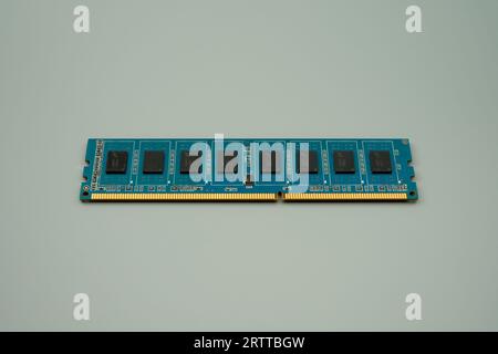 DDR3 memory on a blue PCB, gray background Stock Photo