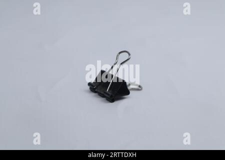 black paper clip isolated on white background Stock Photo