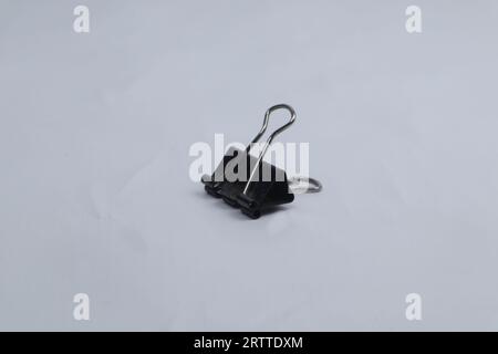 black paper clip isolated on white background Stock Photo