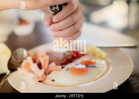Breakfast at hotel. Healthy meal was served on a beautifully set table at the hotel restaurant in the morning. The handcrafted breakfast. Fried eggs Stock Photo