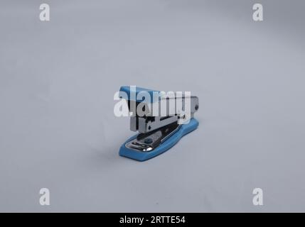 Blue stapler isolated on a white background Stock Photo