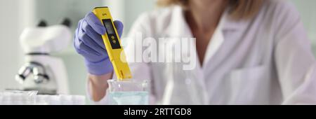 Female scientist conducts research in science laboratory. Stock Photo