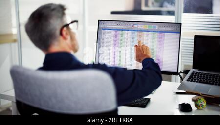 Business Data Audit Spreadsheet On Analyst Computer Stock Photo