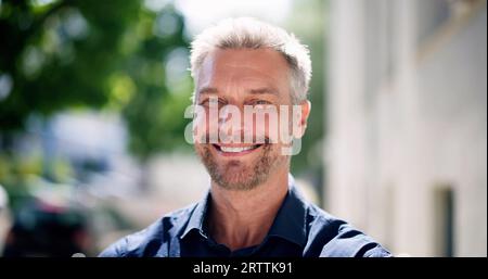Confident Man Portrait. Male Person Standing Outdoors Stock Photo