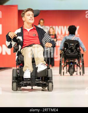 Model walks runway sponsored by Tommy Hilfiger Adaptive for Runway