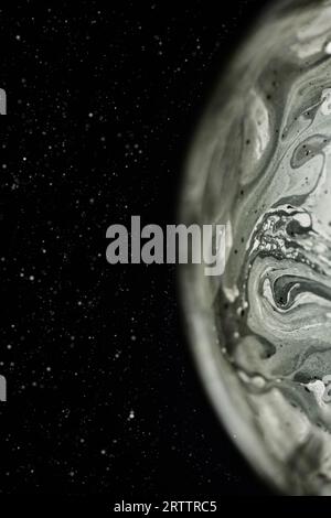 Soap bubble as a virtual grey alien planet in universe on dark background. Abstract soap bubble as an alien futuristic planet. Stock Photo