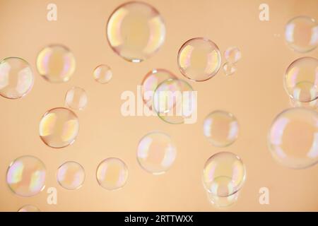 Abstract orange soap bubbles background. Orange soap bubbles wallpaper. Stock Photo