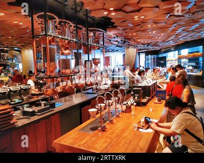 (FILE) Customer consume at the world's largest Starbucks Reserve Roastery in Shanghai, China, August 28, 2019. Stock Photo