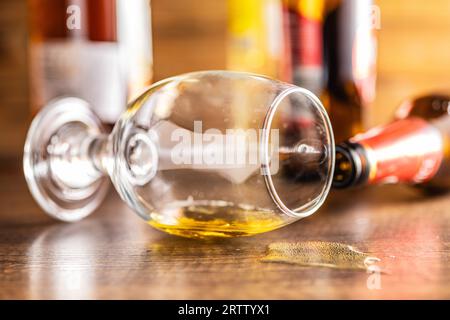 Empty spilled glass of beer on a table. Stock Photo