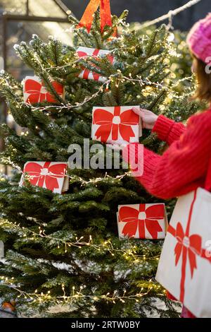 Decorates Christmas tree with big red bows Stock Photo