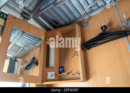 Recumbent seat compartment in the old train Warsaw - Kyiv. View from inside Ukrainian high speed train. Stock Photo