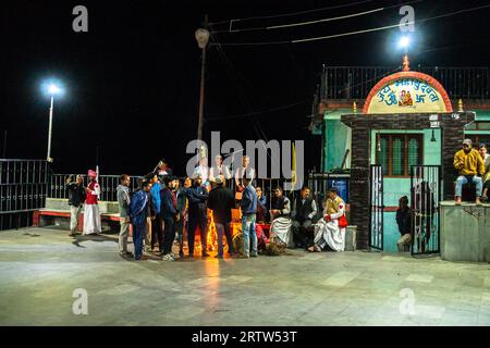 November 30th 2022. Tehri Garhwal, Uttarakhand India. Garhwali locals in Tehri, Uttarakhand, gather around a festival bonfire in winter Stock Photo