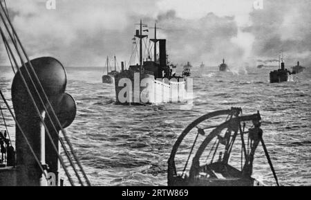 A fleet of merchant ships travelling in convoy in January 1940. Experience gained in World War One, proved that freighters travelling together in large groups with an escort of warships had less risk of attack from enemy U-boats Stock Photo