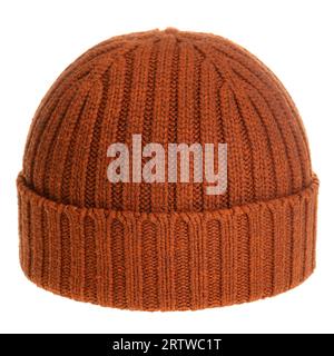 Orange-brown knitted winter bobble hat of traditional design isolated on white background Stock Photo